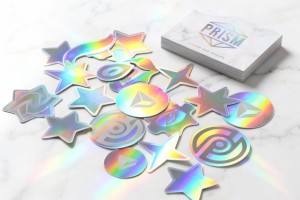 Custom holographic sticker guide showing rainbow diffraction effects on metallized polyester film