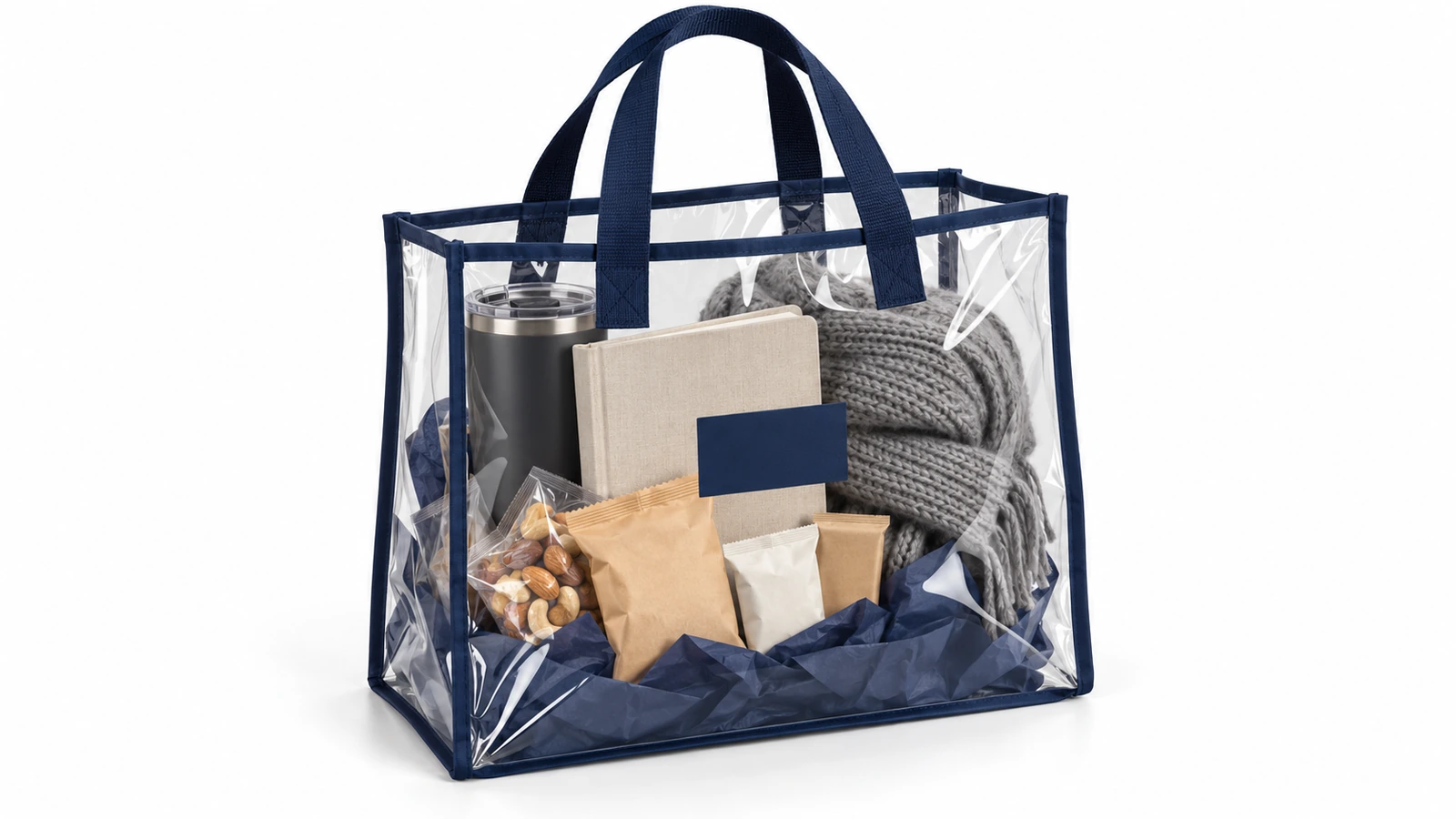 带海军蓝包边的透明 PVC 手提袋，内装一份精选企业礼包：水杯、笔记本、零食和一条折叠围巾，透过袋子全部清晰可见